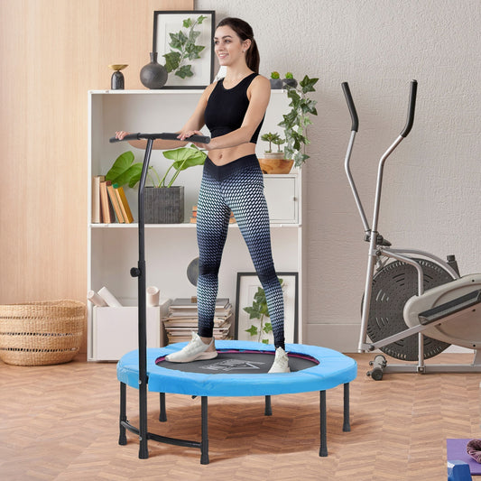 A woman exercising on the blue fitness trampoline in a bright room with other exercise equipment