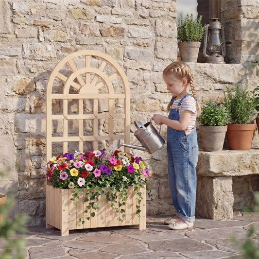 The wooden raised garden bed planter box with trellis is shown with a young girl watering colourful flowers