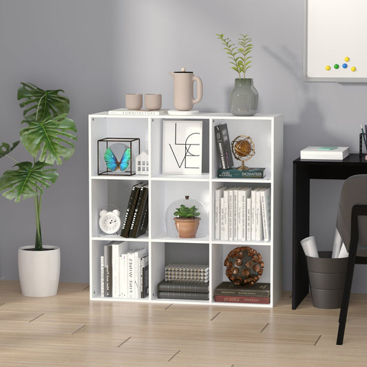 The white cube storage unit is shown in a room with books and decorative items