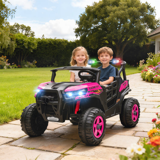Two children enjoying a ride in the pink electric car on a paved garden path