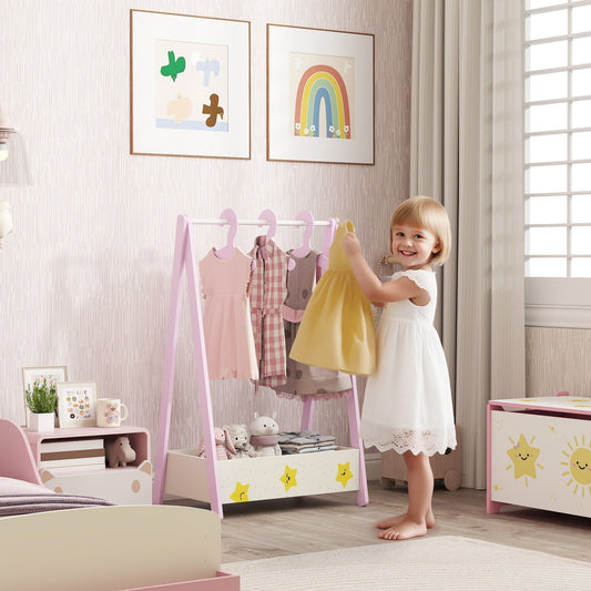 A young girl is putting a yellow dress on a pink A-frame clothing rack in a child's bedroom