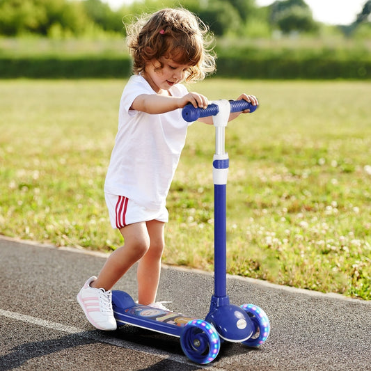 A young child riding the blue three wheel scooter on a path