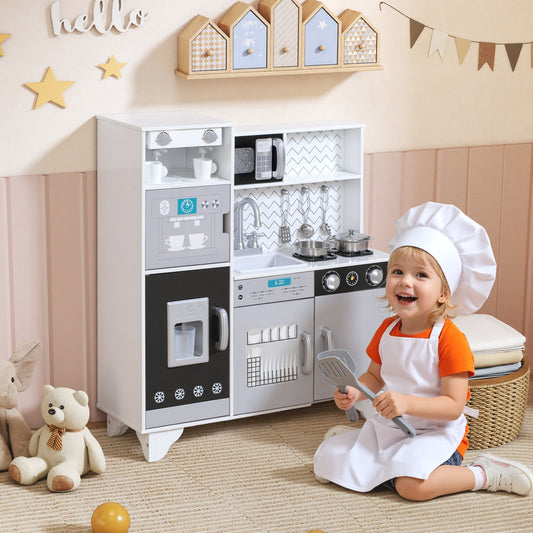 A happy child wearing a chef's hat plays with the toy kitchen