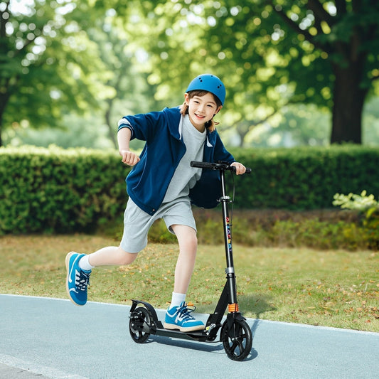 A child wearing a blue helmet rides a black kids scooter in a park