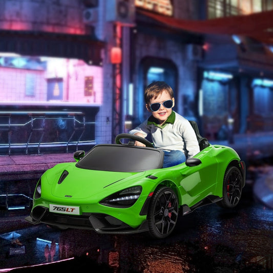 A young boy wearing sunglasses drives the green kids electric car on a city street at night