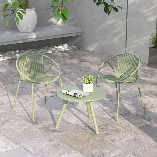Green patio furniture set with two chairs and a round table on a paved patio