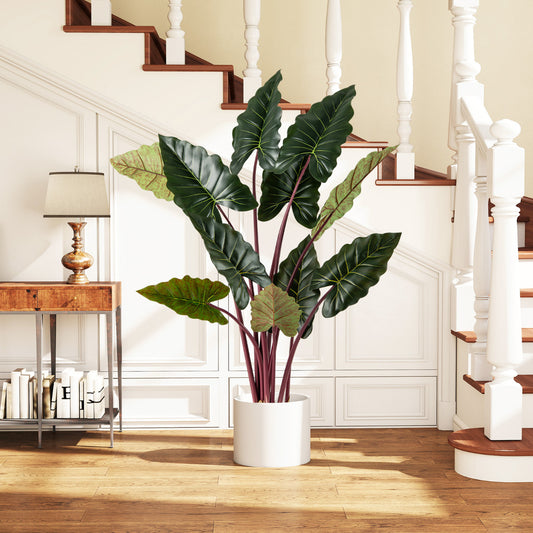 The faux plant in a white pot placed in a hallway next to a wooden console table
