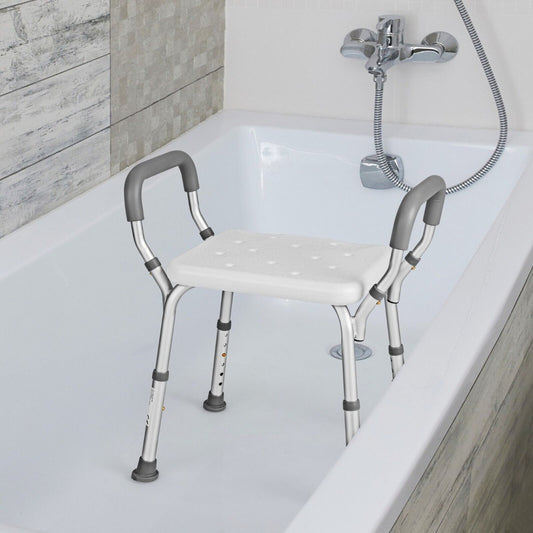 The bath chair shower bench with detachable padded arms placed inside a bathtub