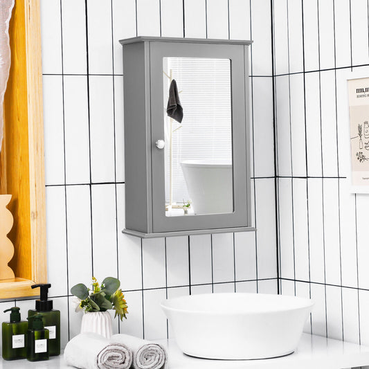 The grey bathroom cabinet is mounted on a tiled wall above a sink