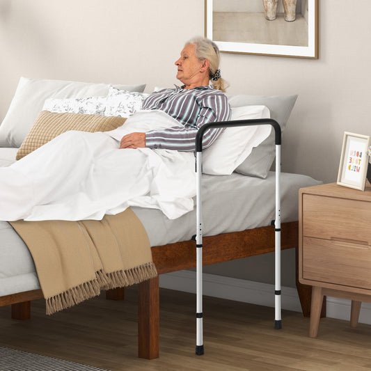 Elderly woman using the bed assist rail to get out of bed safely