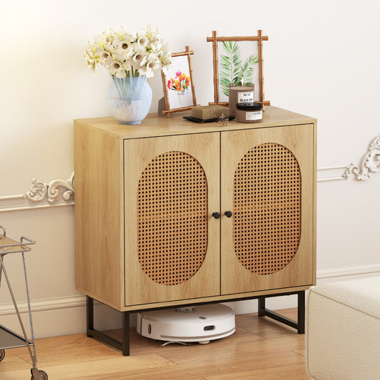 The storage cabinet in a living room with decorative items on top and a robot vacuum underneath