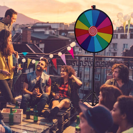 The fortune wheel game set up on a rooftop terrace with people celebrating