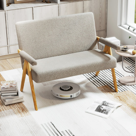The grey sherpa sofa in a modern living room with a robot vacuum cleaner