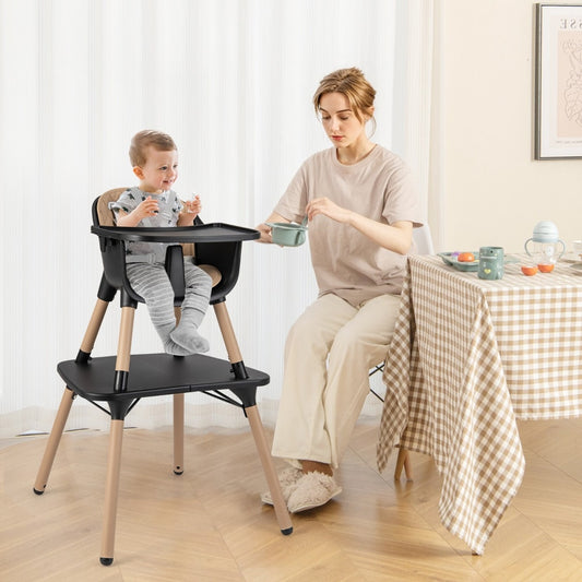 This black high chair is shown with a baby and mother at a dining table