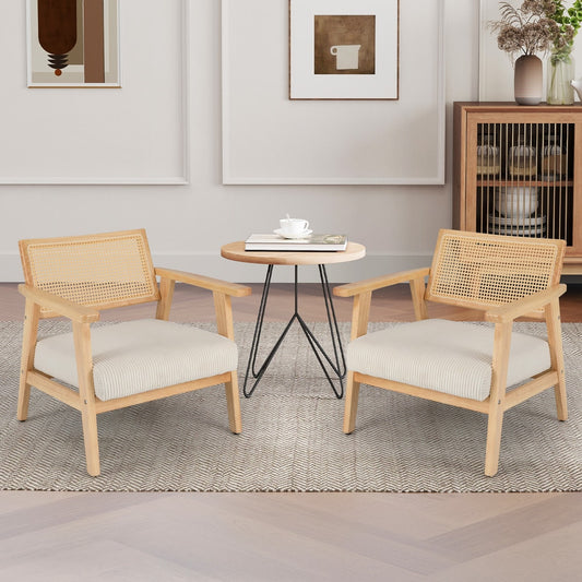 The accent chairs placed on either side of a small round table in a living room