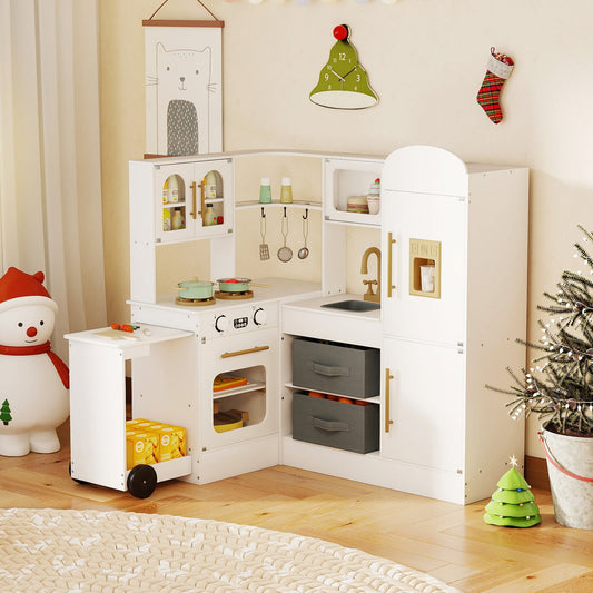 The play kitchen set placed in a cosy room decorated for Christmas with a small tree and ornaments