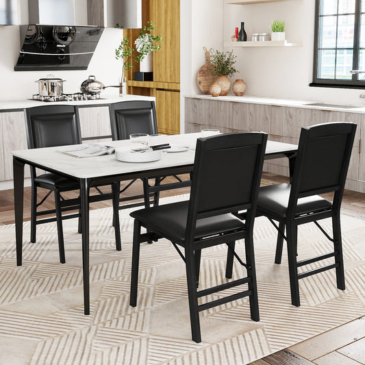 The dining chairs arranged around a white marble table in a modern kitchen setting