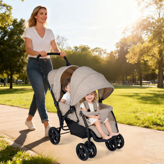 A woman pushes a khaki double pushchair with adjustable backrest and sunshade with two happy babies sitting in it