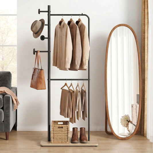 The coat rack placed in a bright living room next to a large oval floor mirror