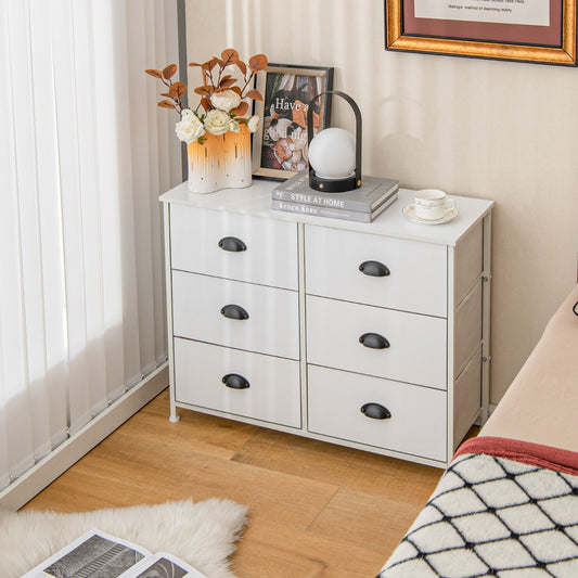 White dresser with six fabric drawers in a bedroom setting next to a window
