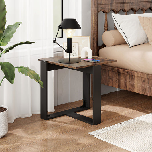 The rustic brown industrial nightstand beside a bed with a lamp and plant