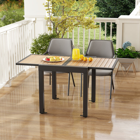 The patio dining table set up on a balcony with two chairs and drinks
