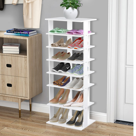 The white shoe rack in a hallway next to a cabinet and a doorway