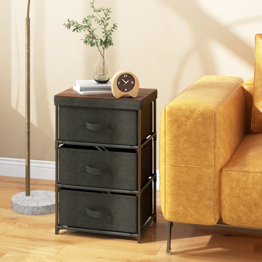 The fabric storage organizer tower unit in black next to a bed
