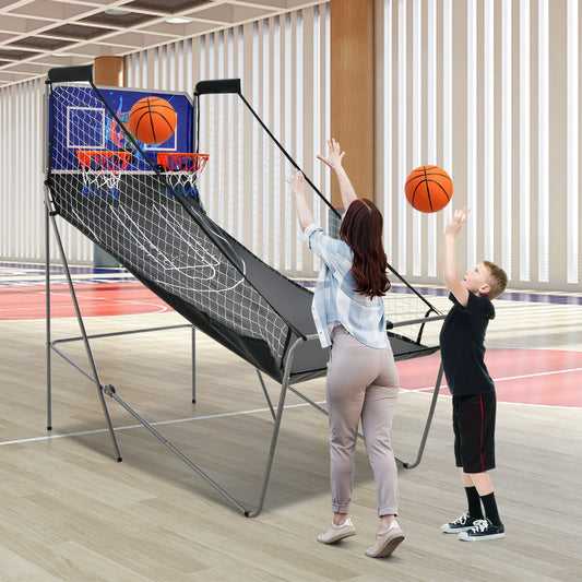 A boy and a woman playing the game room basketball arcade
