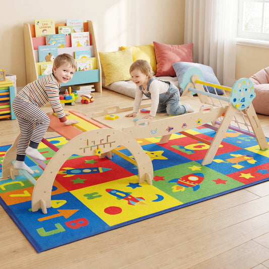 Toddlers playing on the colourful climbing frame in a bright playroom