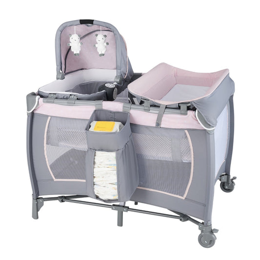 The portable baby playard featuring a pink and grey canopy with hanging toys and a changing table