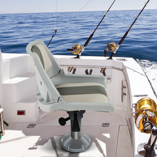The grey boat seat is mounted on a swivel base on a fishing boat