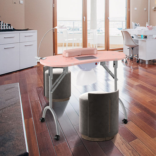 The pink manicure nail table set up in a salon room with two stools