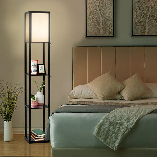 The floor lamp with storage shelves is placed next to a bed in a bedroom setting