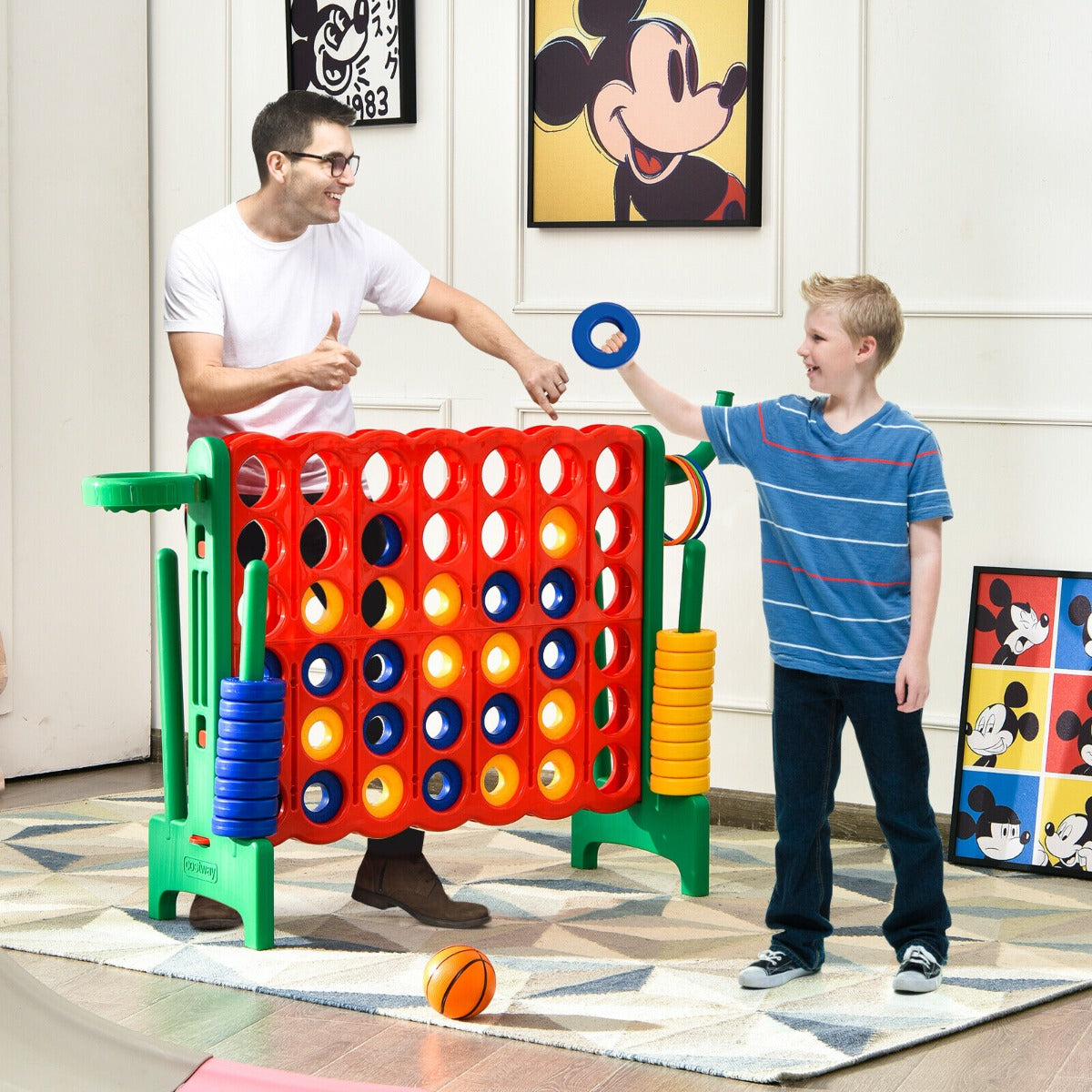 A father and son playing the lawn game indoors