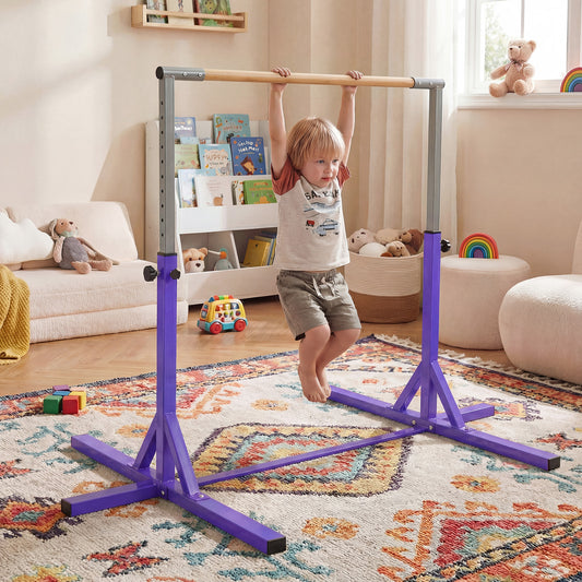 The purple horizontal bar with a child hanging from the wooden rail in a bedroom