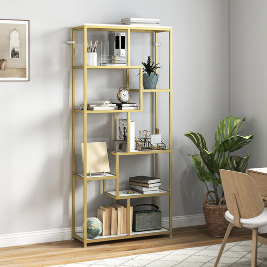 White and gold tone geometric bookcase filled with books and decorative items in a living room