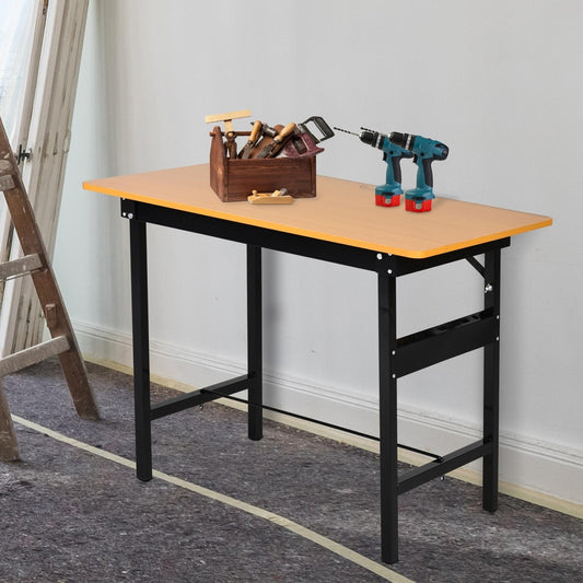 The garage work bench set up with tools on top and a ladder nearby, showing its use as a craft table