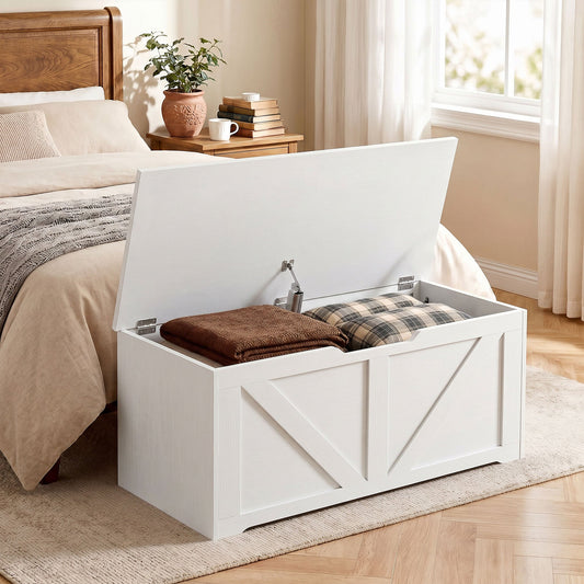 White wood-effect storage cabinet in a bedroom with the lid open