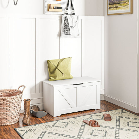 The storage cabinet placed in a hallway with a green bag on top and a rug on the floor