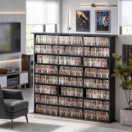 Black media shelving unit filled with DVDs and Blu-rays in a living room setting