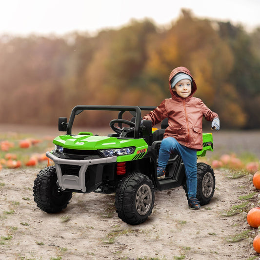 A young child stands next to the green kids electric ride-on car in an outdoor setting with pumpkins