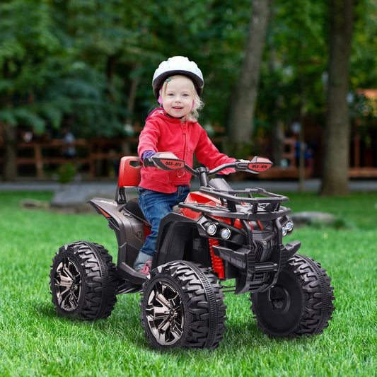 A young child wearing a helmet rides the red and black kids electric quad bike on grass