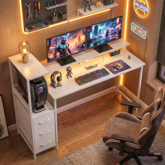 The computer table set up with two monitors, keyboard, mouse and gaming chair