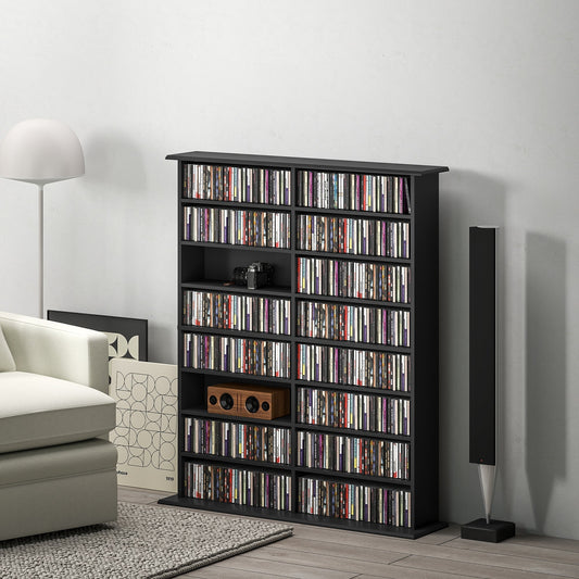 The media shelf filled with various discs in a modern living room next to a sofa