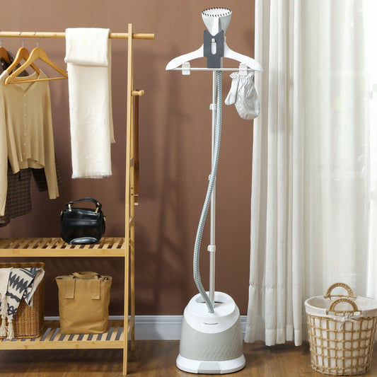 Standing clothes steamer in use in a bedroom with clothes on a rack