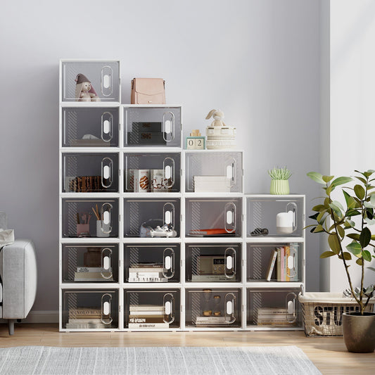 Stack of clear shoe storage boxes filled with shoes and accessories in a room setting
