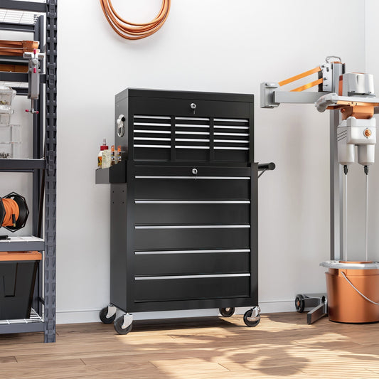 The black tool storage chest on wheels in a workshop setting with tools and equipment around it