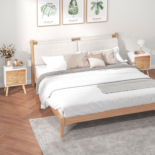 The wooden side tables placed on either side of a double bed in a modern bedroom setting
