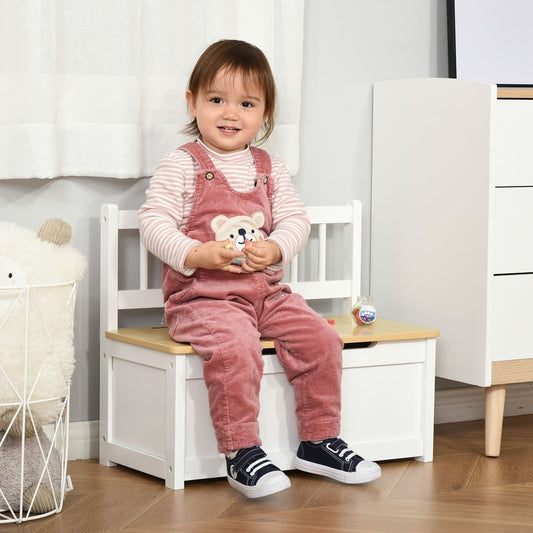 A toddler sits on the white toy box bench, which has a light wood lid